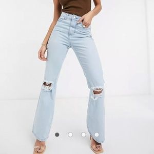 Femme Luxe high waist flares with ripped knees in light blue
